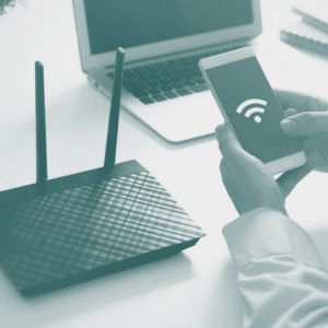 WiFi router and hands holding smartphone