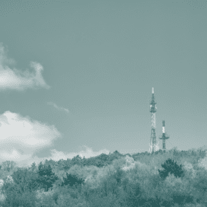 TV towers overlooking forest