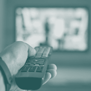 Hand holding a TV controller