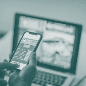 Smartphone and laptop displaying gambling apps