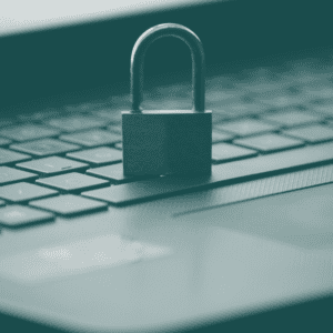 A padlock sitting on a laptop keyboard