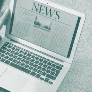 Man reading news on laptop