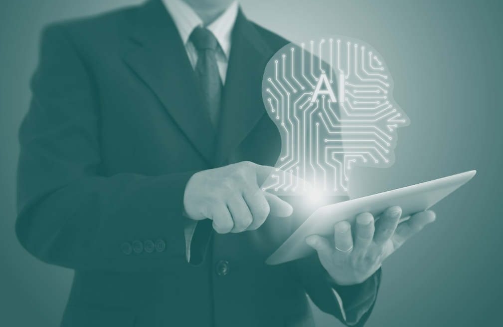 Businessman holding laptop with AI logo