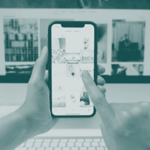 Person holding smartphone displaying advertising