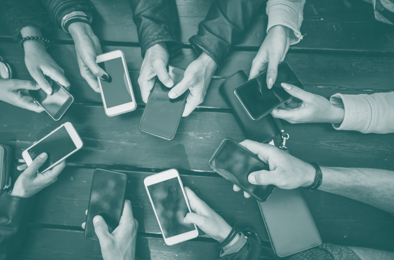 Hands holding many smartphones