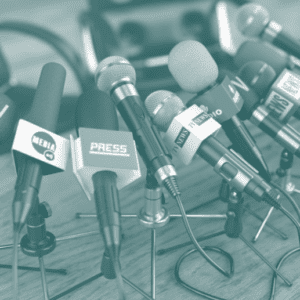 Cluster of interview microphones on a desk